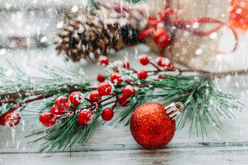 Christmas decorations on a wooden background with snowflakes and copy space	