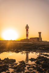 Sunset at the Toston Lighthouse, Punta Ballena near the town of El Cotillo, Fuerteventura island, Canary Islands. Spain