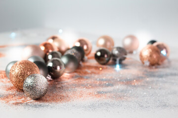 Silver, green, and gold Christmas baubles