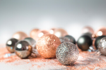 Silver, green, and gold Christmas baubles