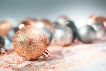 Silver, green, and gold Christmas baubles