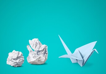 New ideas or transformation concept with crumpled paper balls and origami