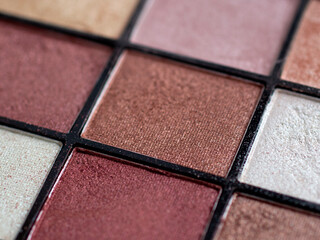 Make-up eye shadow palette close up. Professional multicolor eyeshadow palette. Makeup. Professional multicolor eyeshadow make up palette background. Colorful bright eye shadows set backdrop