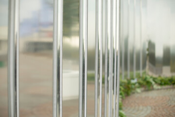 Mirror wall in the park. Architectural element to decorate the city. Reflective surface.