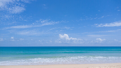 Fototapeta na wymiar Calm beach and Blue Sky Background.