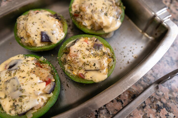 Close-up of summer squash with stuffing and melted cheese