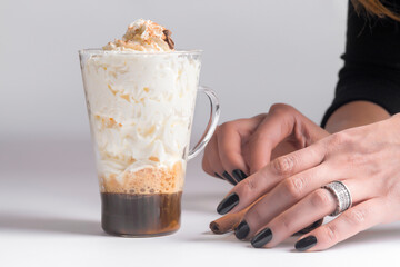 cold fresh ice coffee with cinnamon in white background