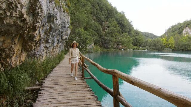 Young woman walking by Plitvice Lakes