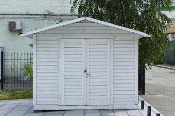 Fototapeta na wymiar White garage with closed doors. 