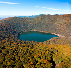 Aerial  drone panorama view of the fall season over Saint Anne (Sfanta Ana) volcanic lake. Forest...