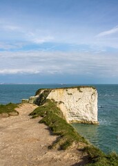 Fototapeta na wymiar Old Harry Rocks standing tall on Handfast Point at the southern end of Studand Bay one of the most famous landmarks on the south coast