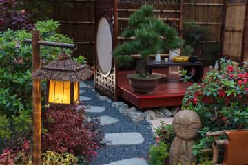 Lantern in beautiful oriental Japanese backyard garden - 460834014