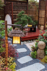 Fototapeta na wymiar Lantern in beautiful oriental Japanese backyard garden