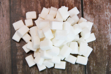 square cubes of white refined sugar