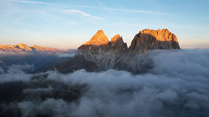 Mountains in the clouds at sunrise. Italian Dolomites