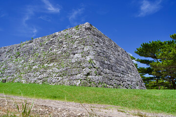 Stone wall with blue sky at Zakimi Castle Ruins.