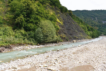 Rapid mountain river in a gorge in Western Caucasus.
