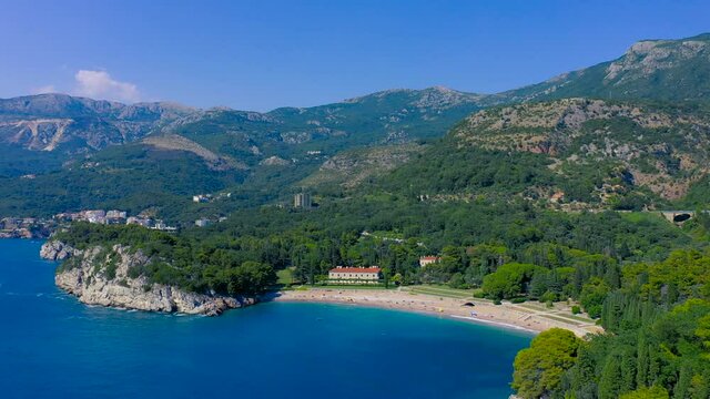 Adriatic sea coast, Milocer queens beach, Sveti Stefan, Montenegro. Aerial drone view 4K.