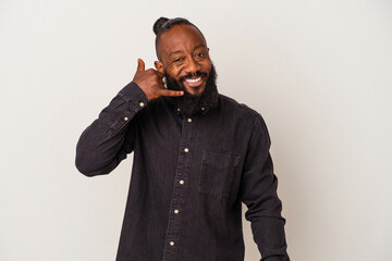 Fototapeta premium African american man with beard isolated on pink background showing a mobile phone call gesture with fingers.