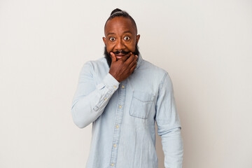 African american man with beard isolated on pink background doubting between two options.