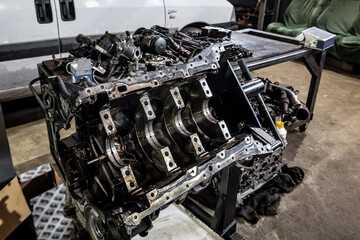 disassembled car engine in the workshop