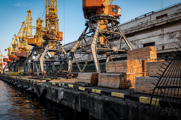 port cranes load wooden bars