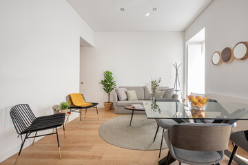 Living room with glass dining table in a vacation rental apartment