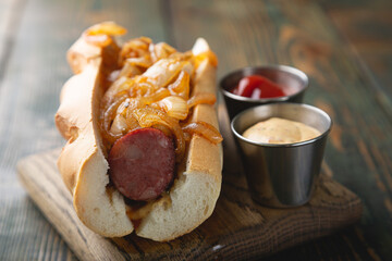 Hotdog with smoked sausage and fried onions