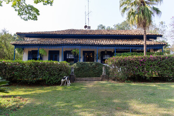 old colonial house on a historic farm in São Paulo, Brazil. Blue wooden windows.