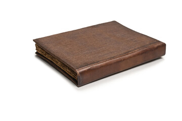 An old brown book isolated on white background.