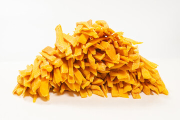 Dry tasty mango slices as a background.