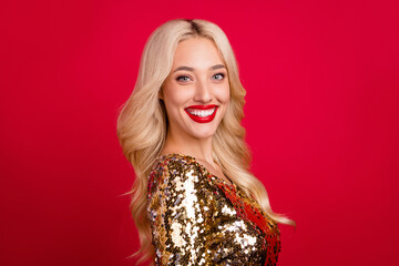 Photo of pretty shiny young woman dressed gold dress smiling isolated red color background