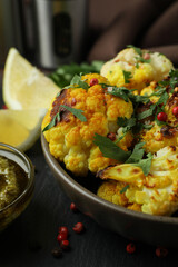 Concept of tasty food with baked cauliflower, close up