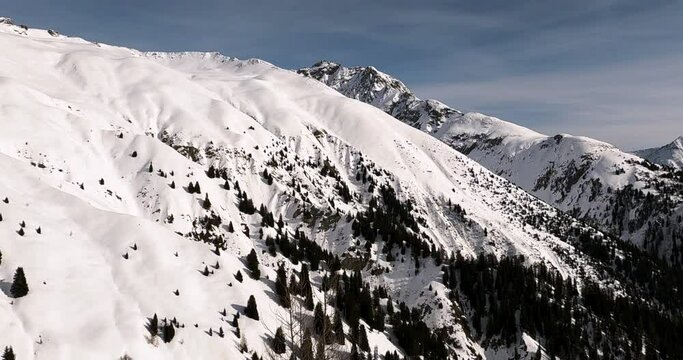 Panorama winter view in the tyrolean alps with lots of fresh snow. Cold winter day in the austrian alps on the way to a beautiful mountain peak. Tirol austria ischgl 4K