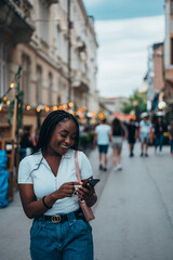 Beautiful african american woman using smartphone