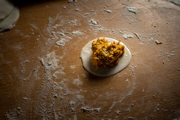 Preparation of sorrentino stuffed with pumpkin and ricotta