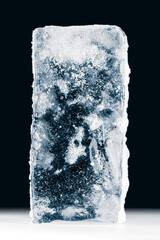 A big textured rectangle of ice on black background.