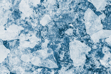 Fototapeta na wymiar Ice pieces texture background. Crushed ice blue-toned pattern. 