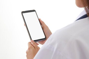 Female doctor holding a black smartphone with a white touch screen for online video calls Check the patient for symptoms. concept of medical services in hospitals, social distancing