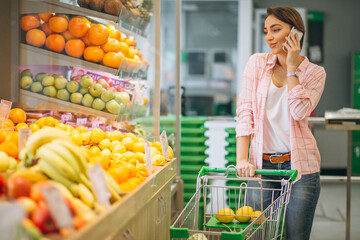 Woman buying at grocery store