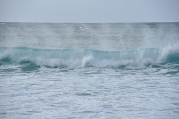wave breaking on the beach