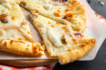 seafood pizza white sauce Takeaway mussel, squid, octopus, shrimp cheese fast food fresh meal snack on the table copy space food background rustic 