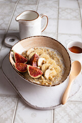 Delicious breakfast with oatmeal porridge and fruits