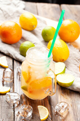 Citrus lemonade. On a wooden table.