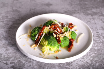 salad of broccoli dried tomatoes pine nuts and cheese