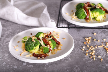 salad of broccoli dried tomatoes pine nuts and cheese