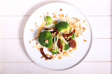salad of broccoli dried tomatoes pine nuts and cheese