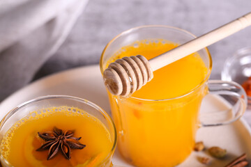 Tea with sea buckthorn and spices is on the table