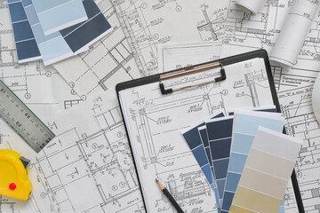 Architect works remotely from home in quarantine, lockdown covid 19 coronavirus. Remote work, stay home, new normality, social distance. Architect design working drawing sketch plans blueprints