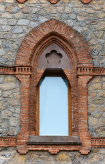 Fototapeta premium Old brick window in an old building in the Cantabria region of Spain.